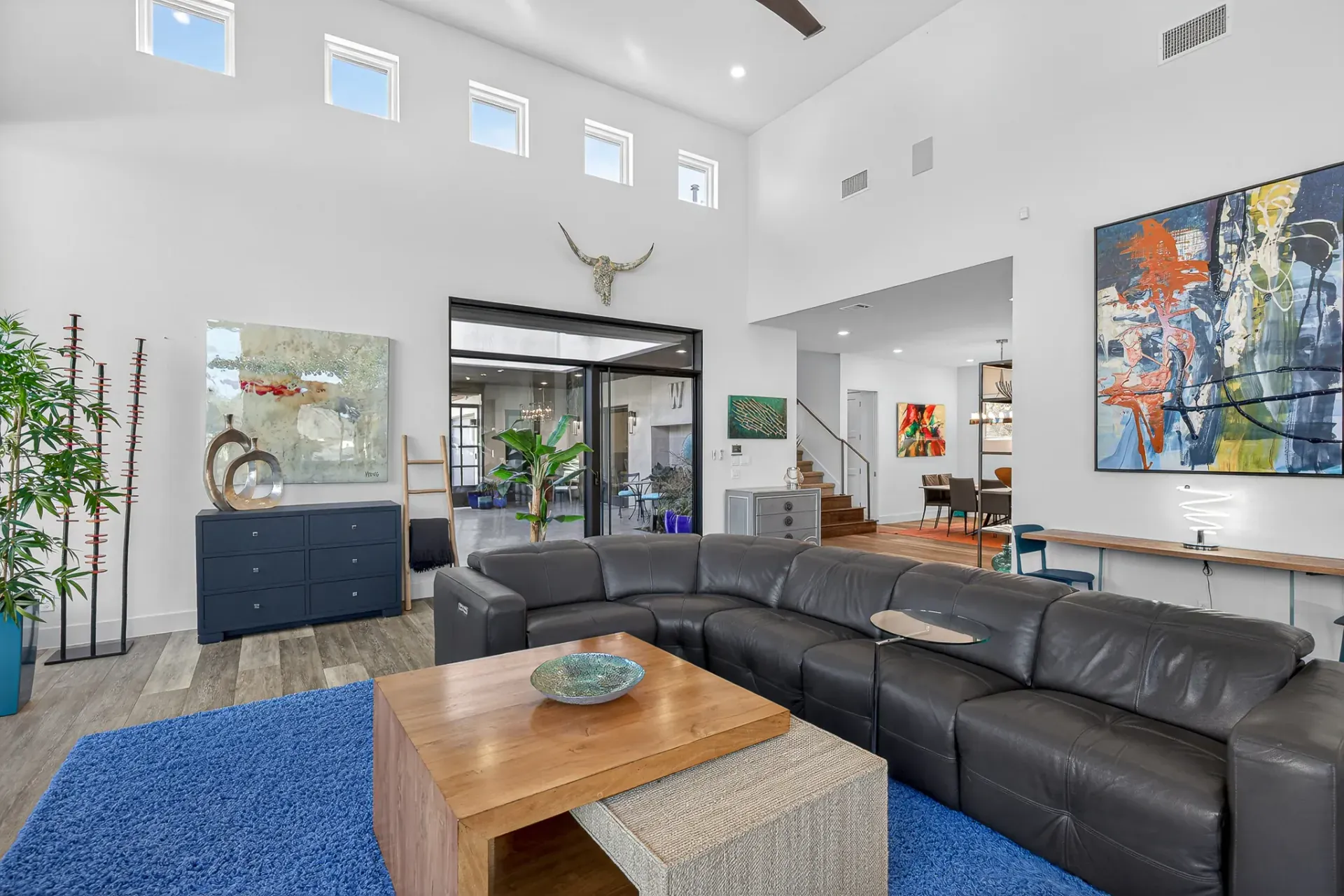 Great room with contemporary art and high ceilings